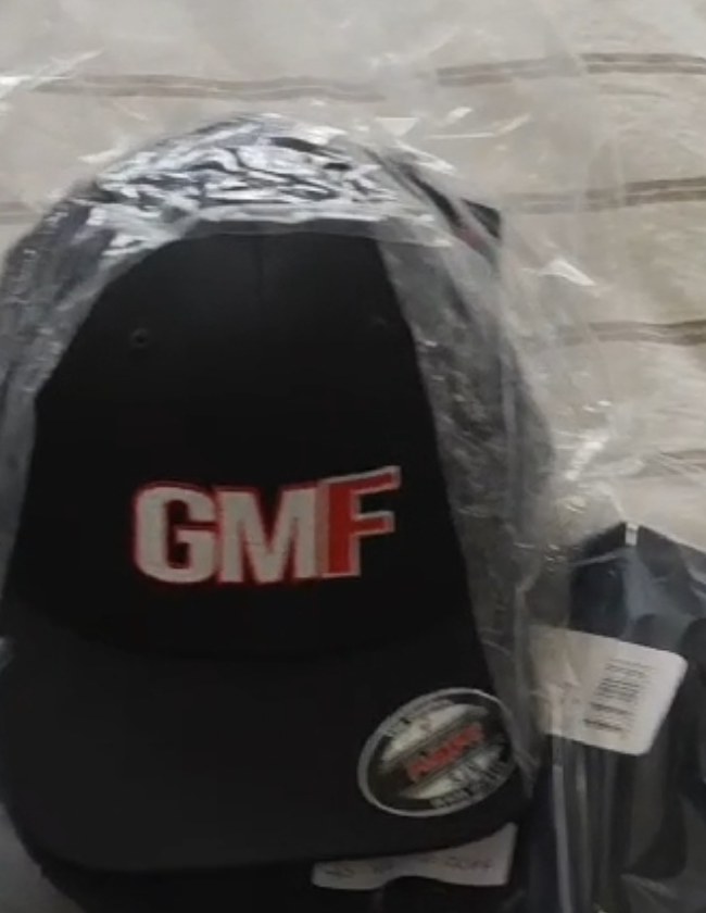 Black GMF cap with embroidered red and white logo